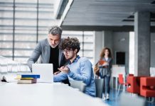 MBA student and professor checking a recommendations