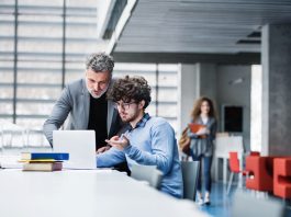 MBA student and professor checking a recommendations