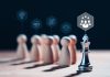 Chess king stands with wooden figures and leadership icons, representing the concept of effective leadership, meritocracy, highlights the importance of strategy, competition and intelligence in achieving success