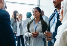 Corporate event with diverse attendees enjoying refreshments and networking